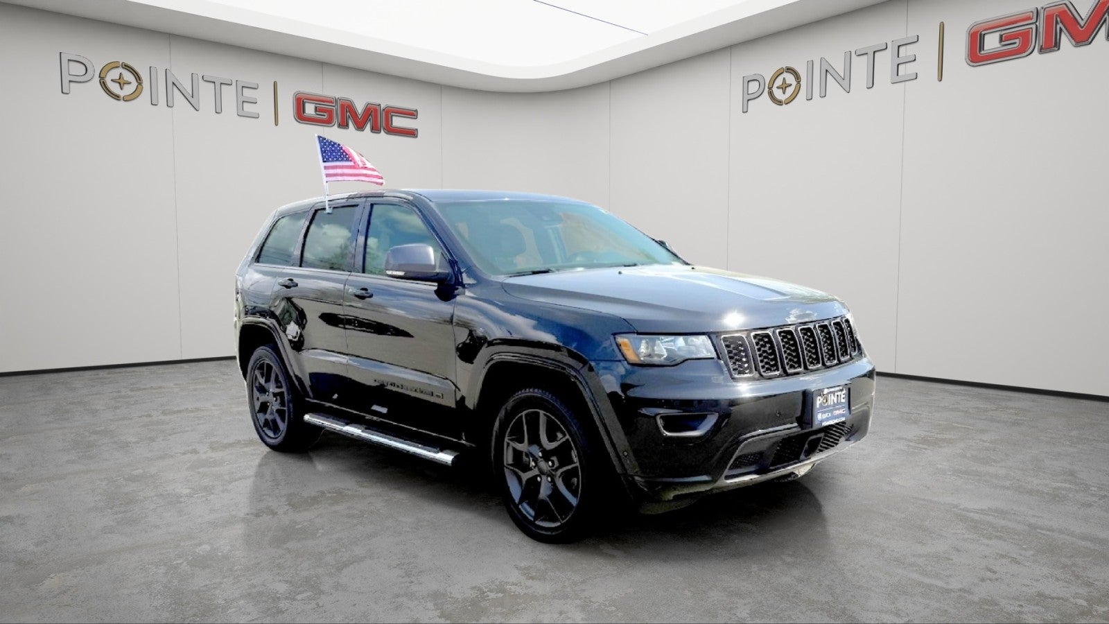 2021 Jeep Grand Cherokee 80th Anniversary in Black — front three-quarter view