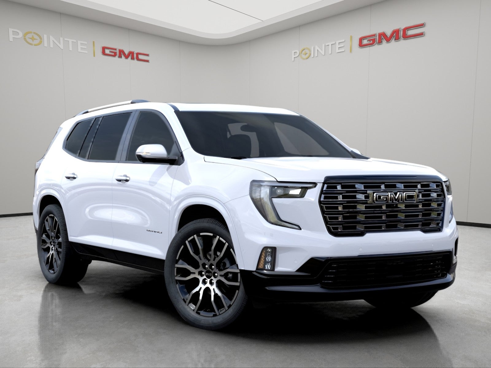 2026 GMC Acadia Denali Ultimate in Glacier White Tricoat — front three-quarter view