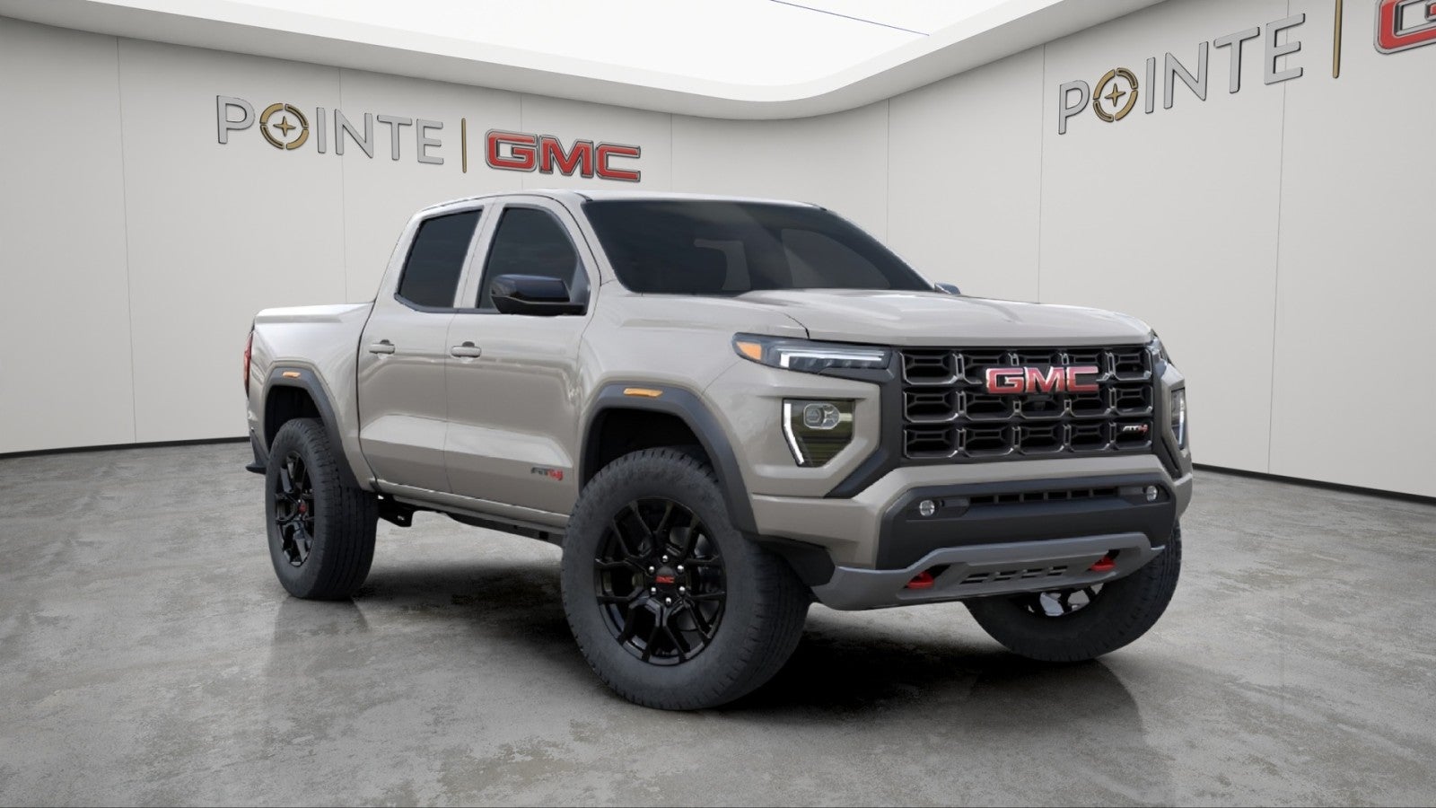 2026 GMC Canyon AT4 in Coastal Dune — front three-quarter view