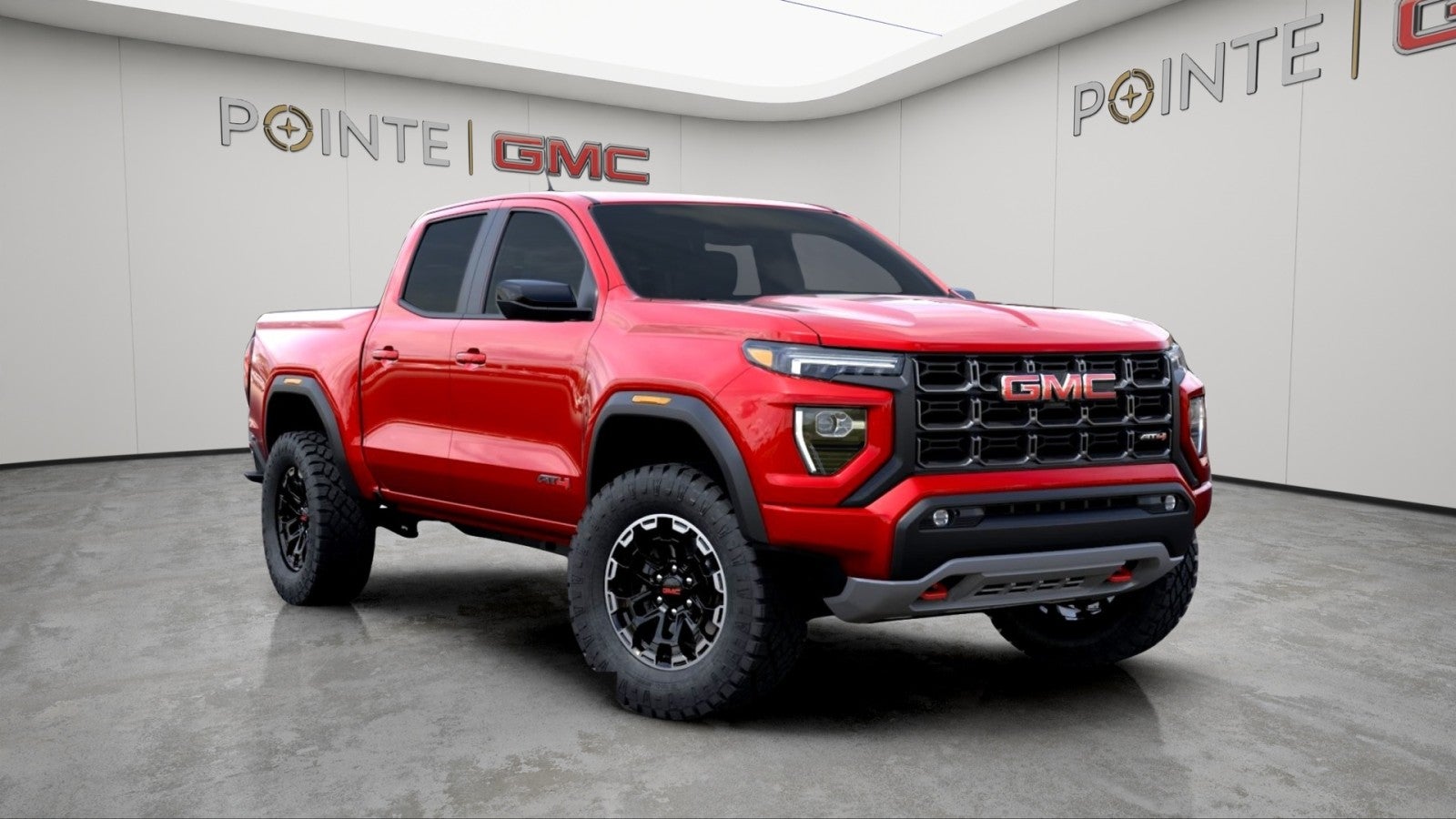 2026 GMC Canyon AT4 in Volcanic Red Tintcoat — front three-quarter view