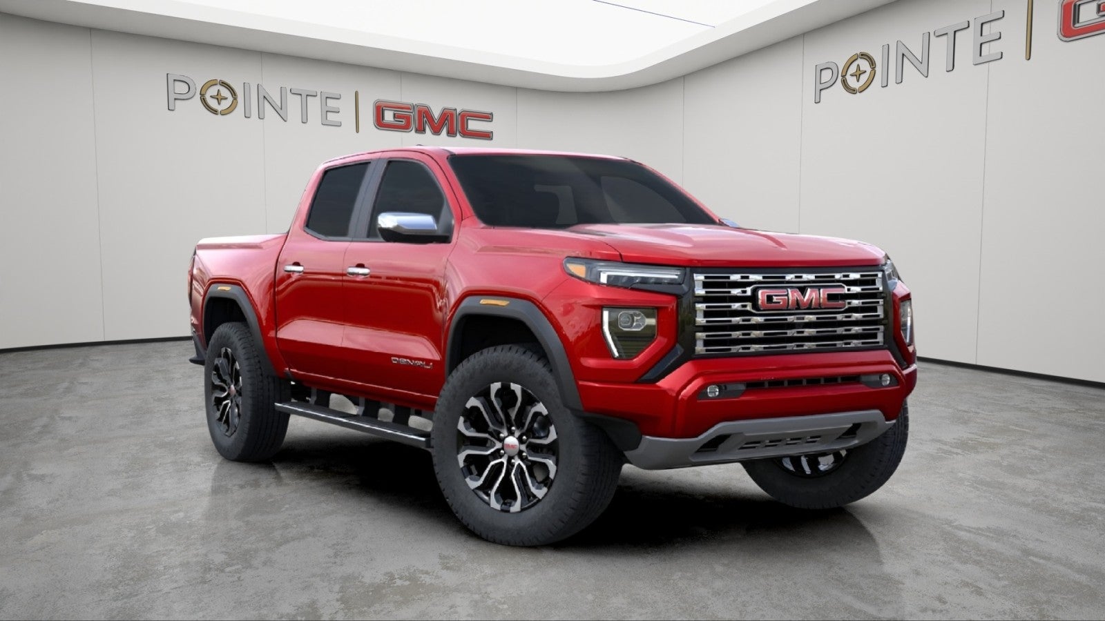 2026 GMC Canyon Denali in Volcanic Red Tintcoat — front three-quarter view