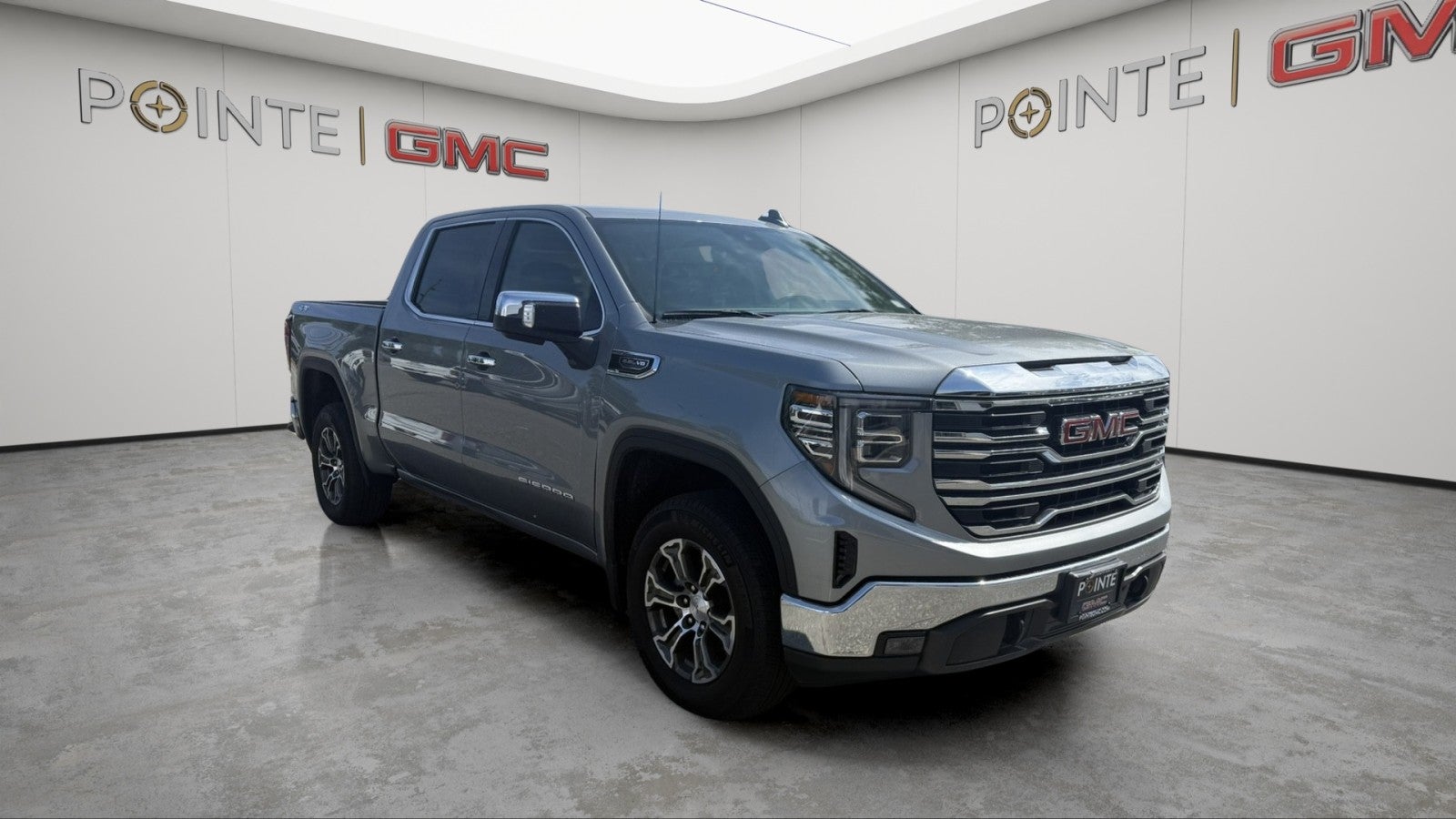 2026 GMC Sierra 1500 SLT in Sterling Metallic — front three-quarter view