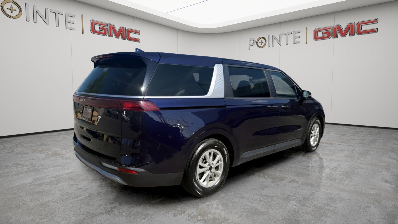 2024 Kia Carnival — rear three-quarter view